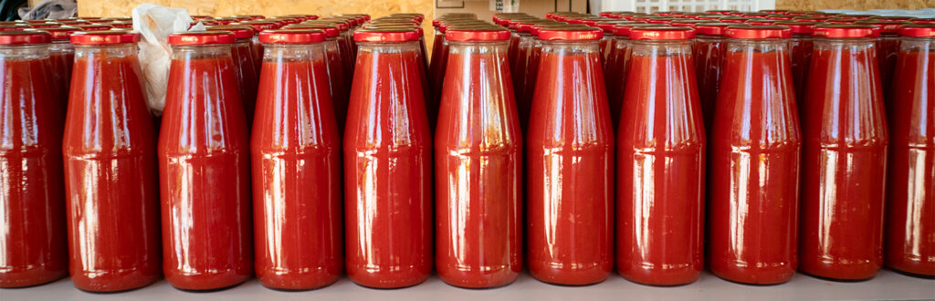 Tomato Sauce in Line Bottles of homemade tomato souce alligned